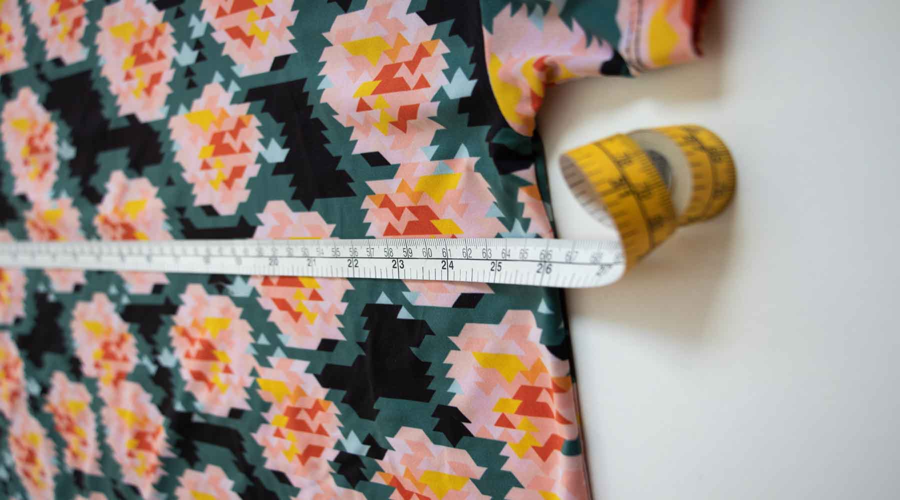 Measure 2.5cm below the armhole to find a garments chest measurement