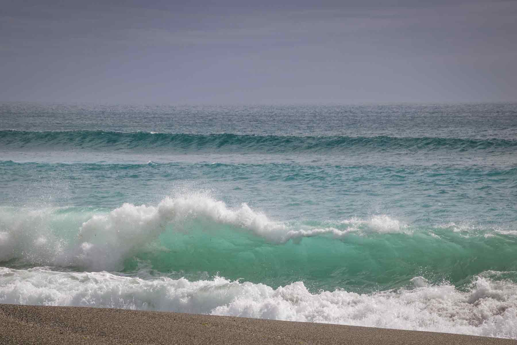Wave crashing on the beach at Martins Bay at the end of the Hollyford Track Fiordland