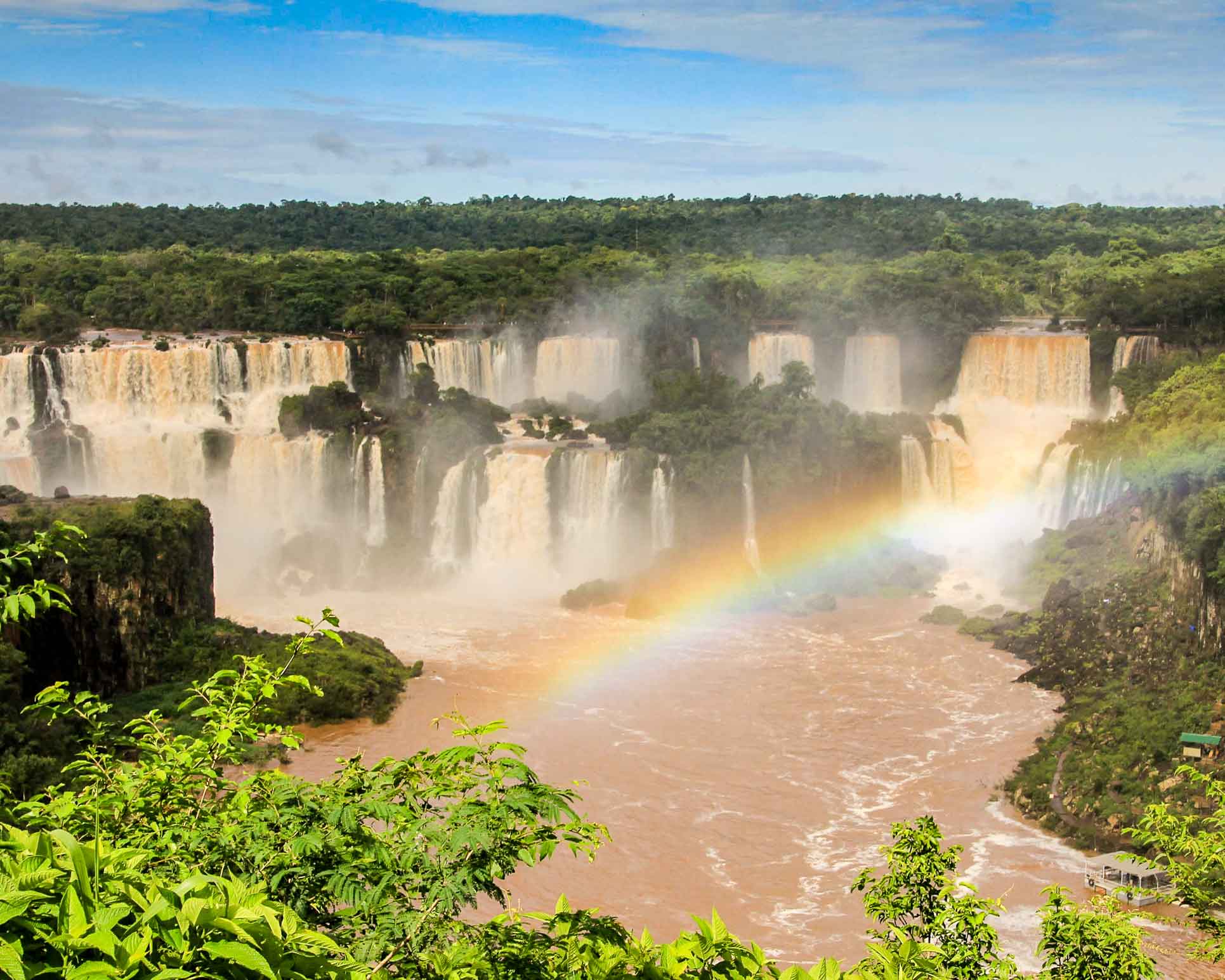 Iguazu Falls with a rainbow in front