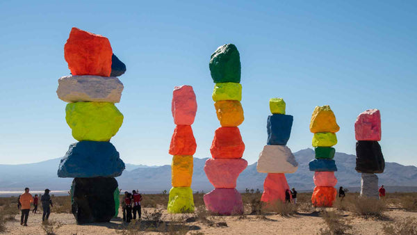Seven Magic Mountains sculpture of massive rock towers in bright colours in the desert near Las Vegas
