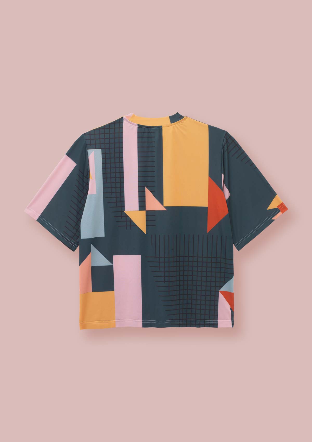 Back view of a Geometric block print t-shirt with a dark green base, pink, yellow, orange, peach, sea green and black the Asmuss Drew T-shirt